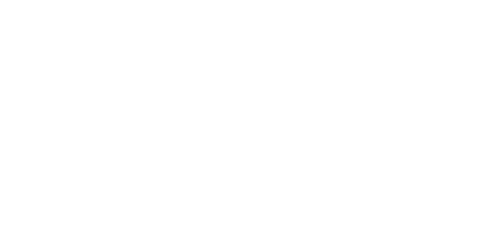 Outline of two engineers in hard hats reviewing a wall-mounted control panel.