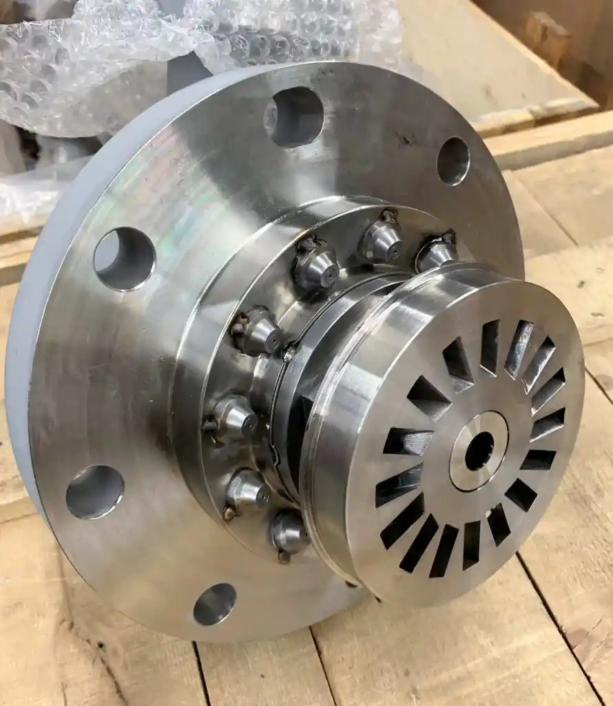 Industrial metal component with circular design on wooden surface