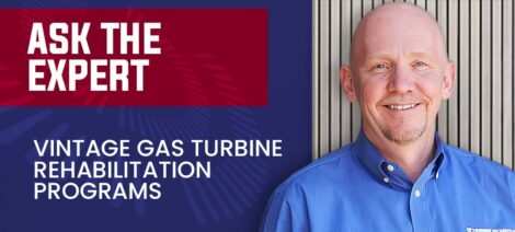 Expert talks about vintage gas turbine rehabilitation programs with a smiling professional in a blue shirt.