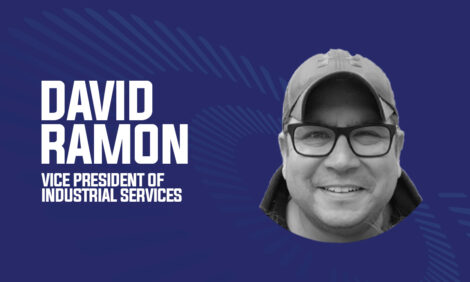 Man in a cap smiling, labeled as Vice President of Industrial Services, on a blue background.