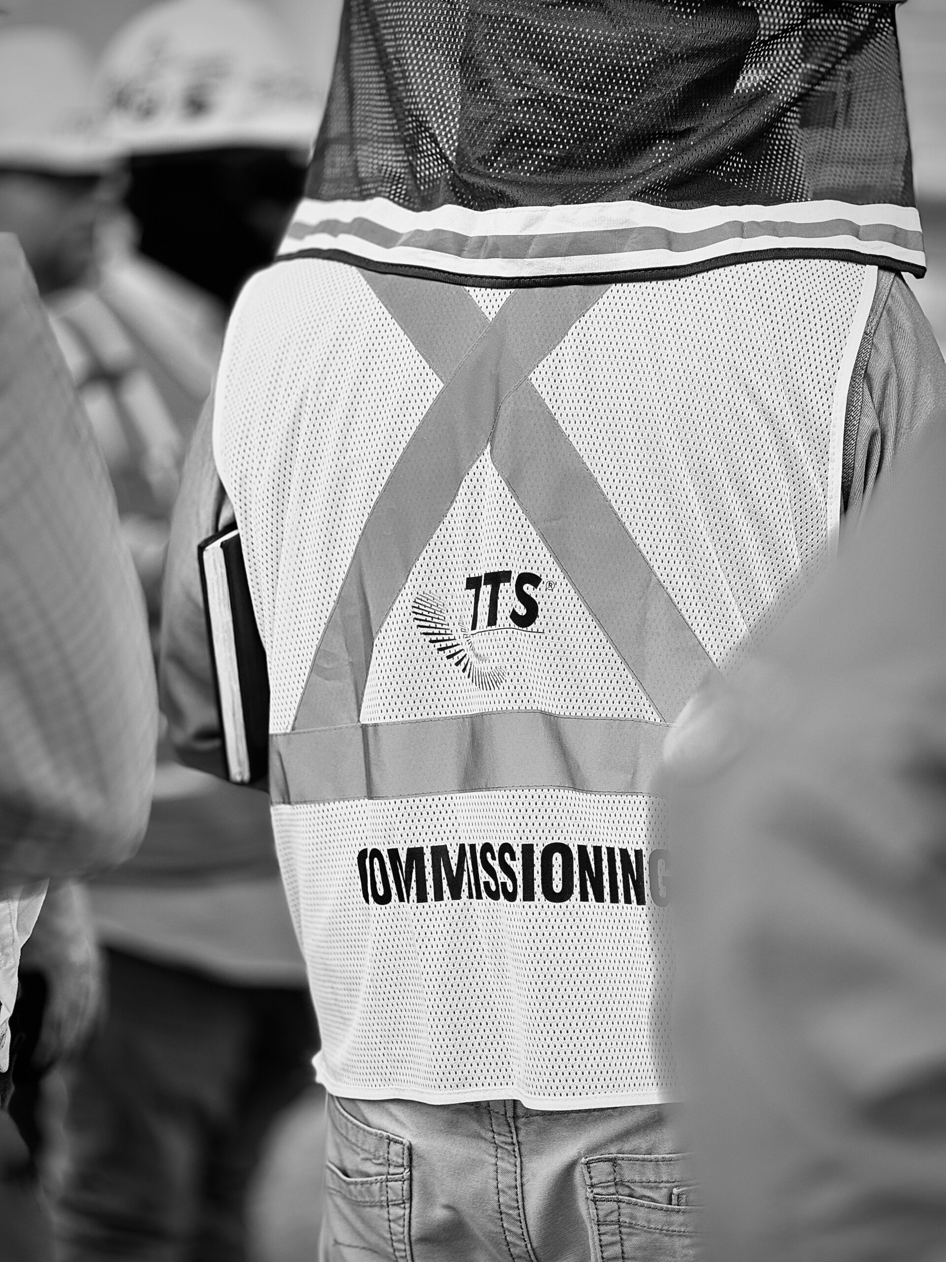 Person in a TTS Energy Services vest during a commissioning event.