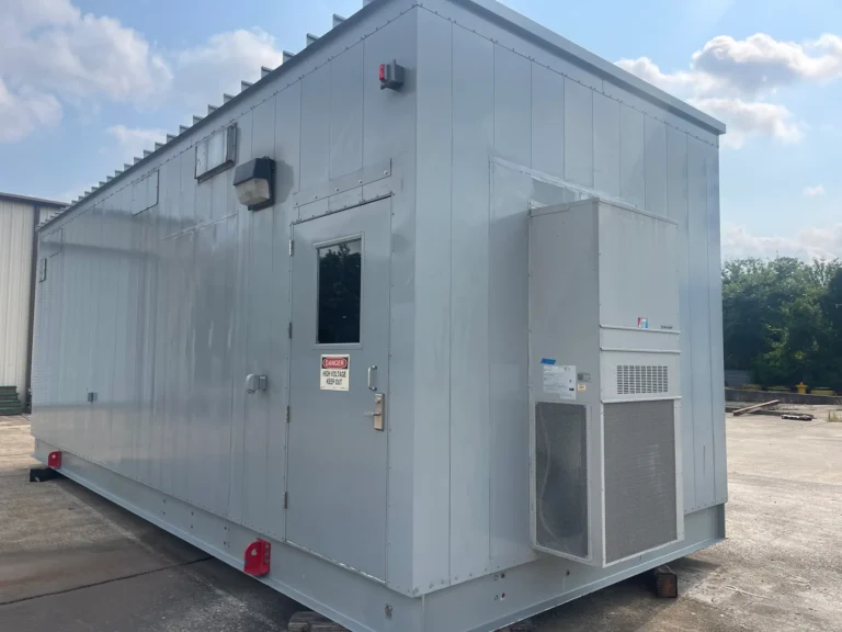 Exterior of a prefabricated electrical house (E-House) built for housing and protecting critical electrical equipment, featuring a high voltage warning on the door and an air conditioning unit for temperature control.