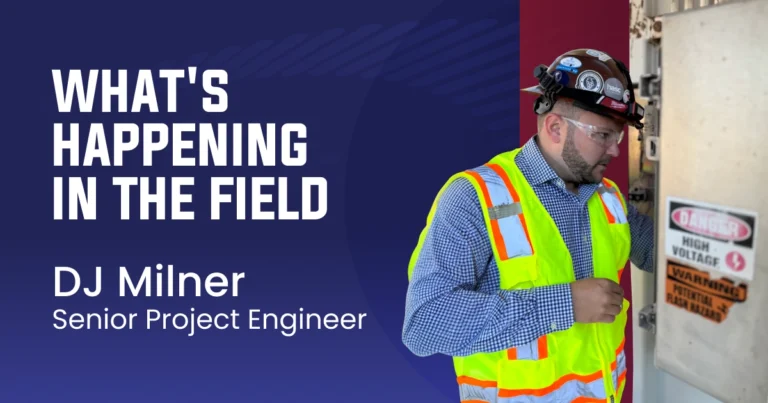 Senior project engineer DJ Milner in safety gear inspecting field equipment.