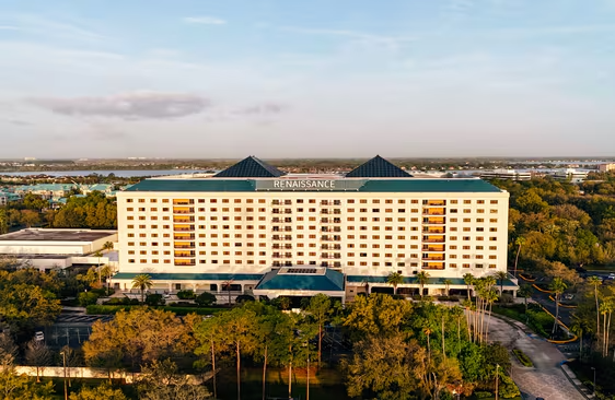 Renaissance hotel exterior with trees and parking